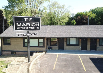 Sign of the Marion apartments close up.
